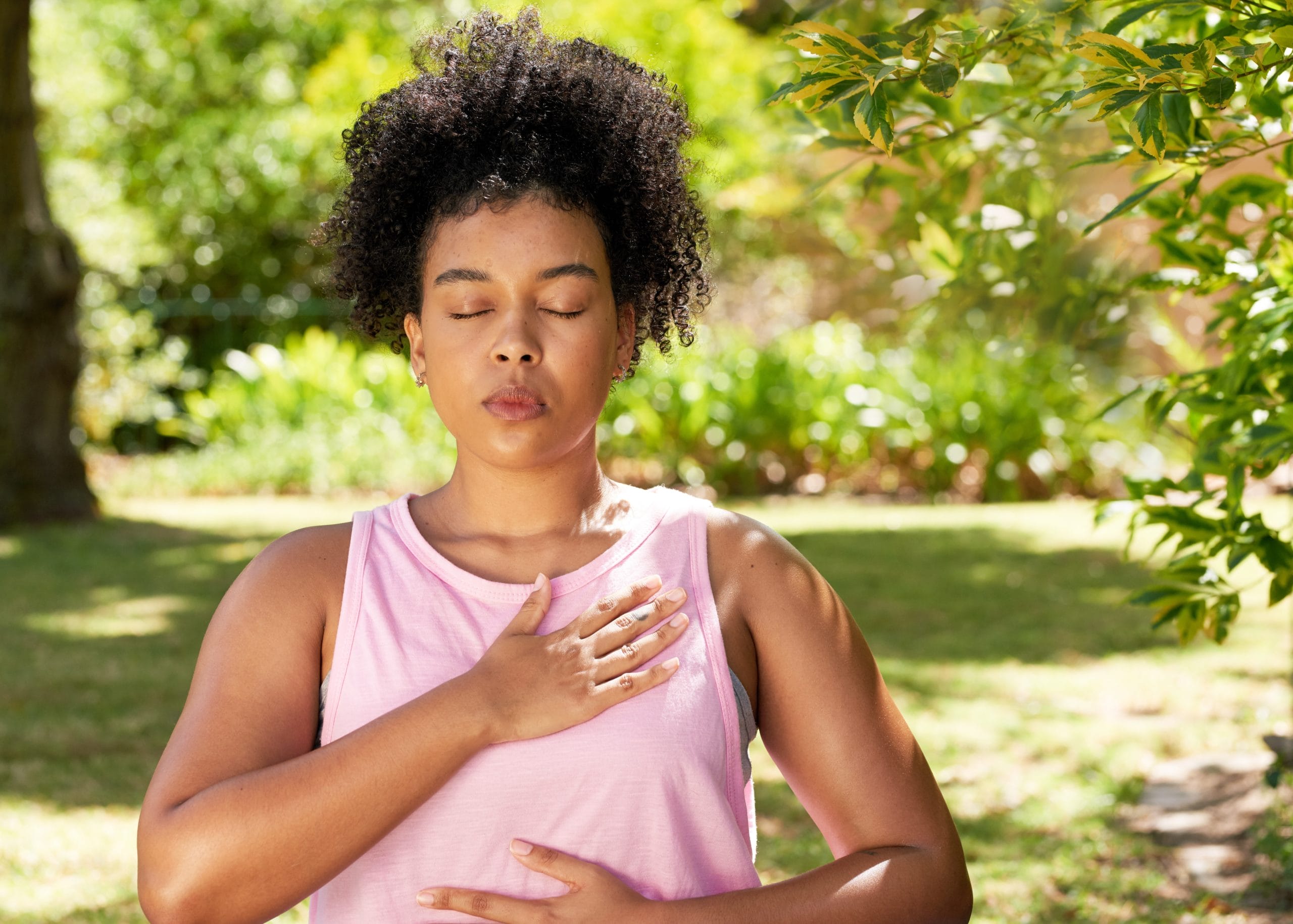 Young,Mutli-ethnic,Woman,Practices,Deep,Belly,Breathing,,Meditation,In,Park